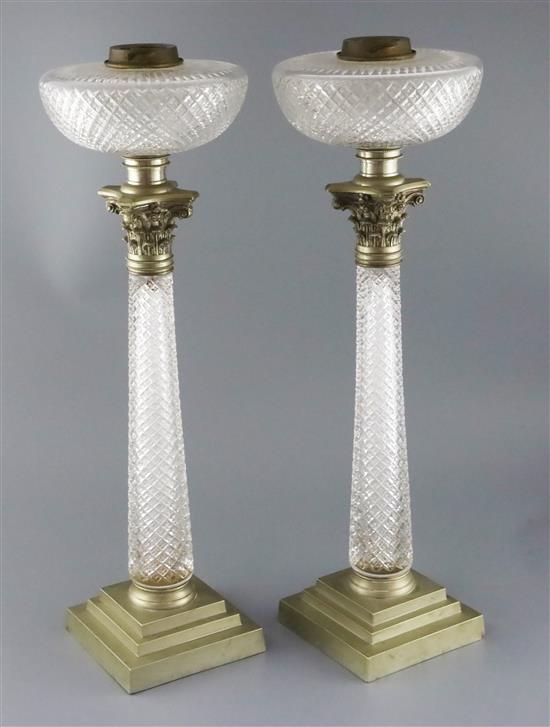 A pair of Victorian Hinks & Sons Patent silver plate mounted cut glass oil lamps, height 22.75in.